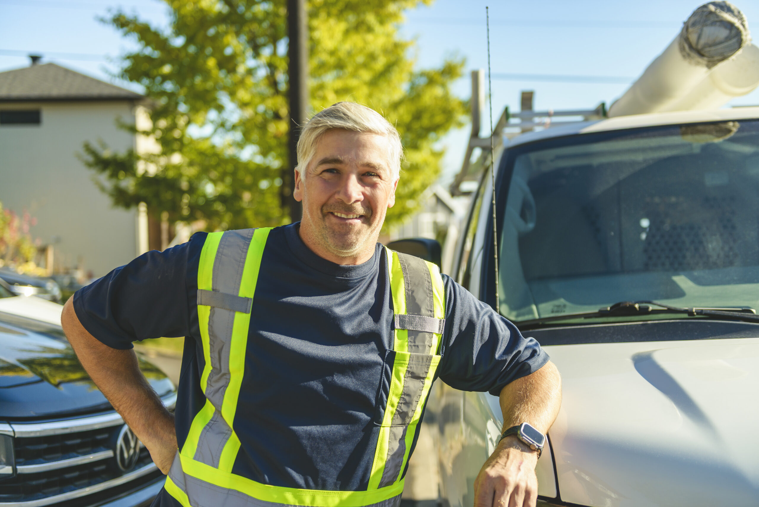 A Happy professional truck driver driving his truck